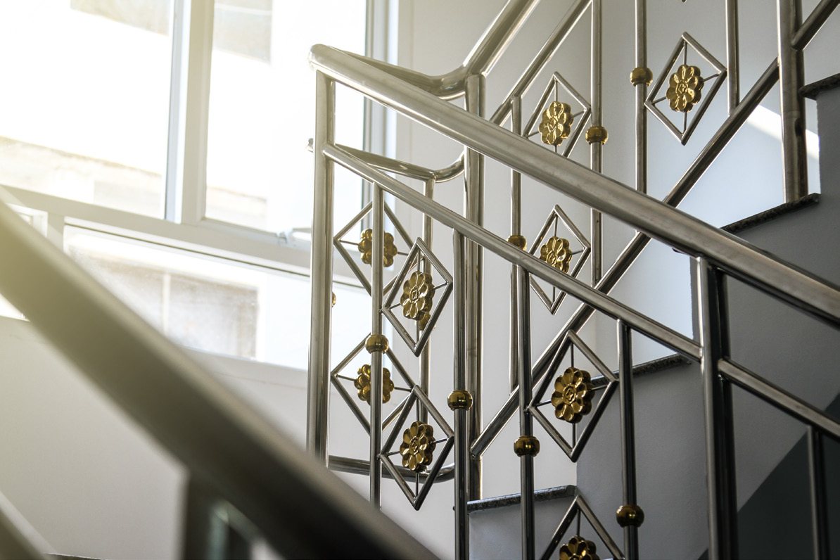 Decorative metal and glass staircase railing